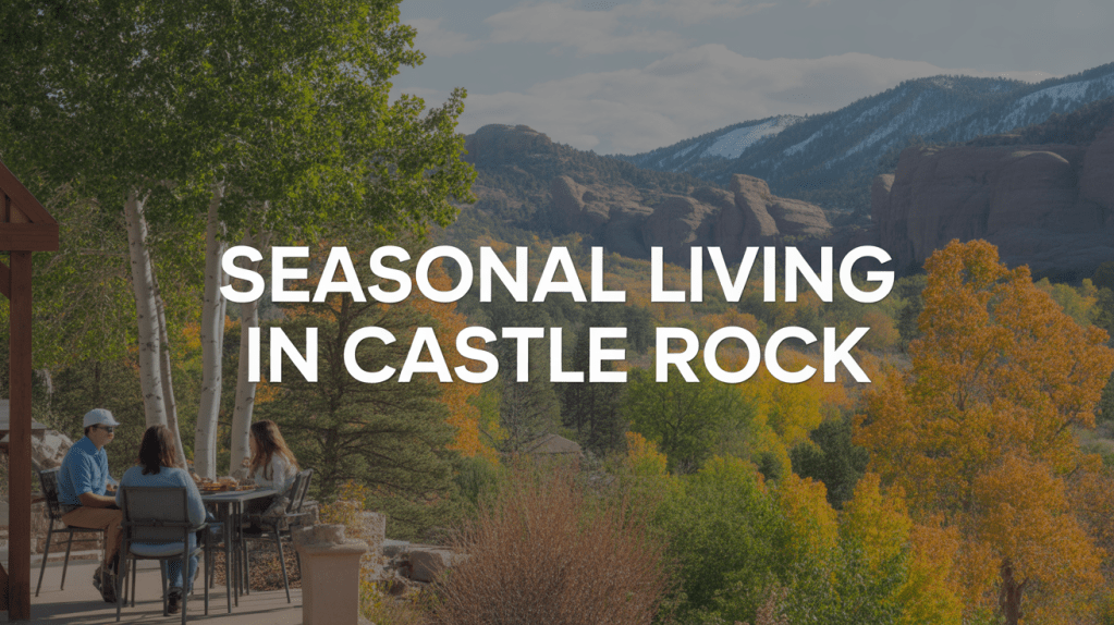 A group of people enjoying outdoor dining on a patio surrounded by colorful autumn foliage in Castle Rock.