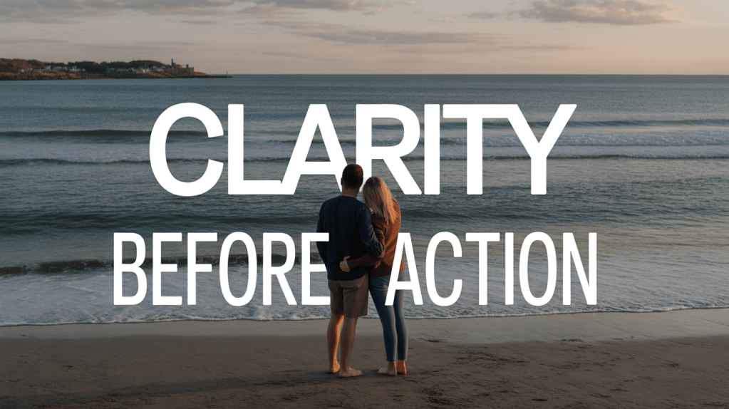 A couple standing on a beach, watching the ocean waves, with the text 'CLARITY BEFORE ACTION' overlaying the image.